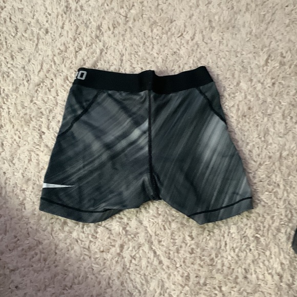 These are dry fit Nike pros. Super good for running or wearing underneath things - Picture 2 of 2